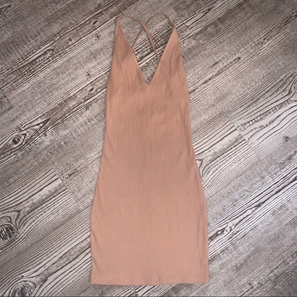 Makers of Dream tan/nude mini dress with low back halter top